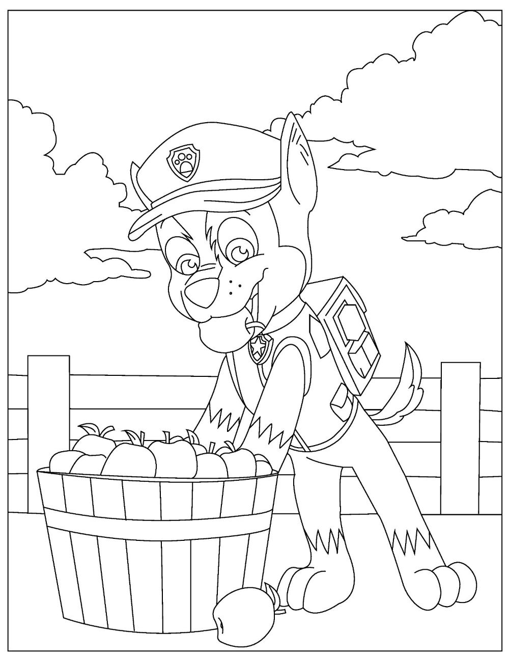 Chase eating an apple from a bucket of apples.