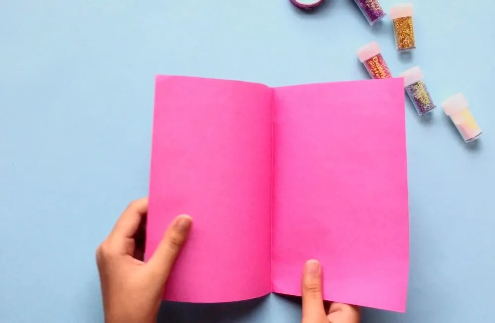 How to Make a Flamingo Birthday Card with Easy Steps (for Kids) Fold pink paper in half